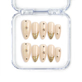 Naillover handmade Singapore almond press on nails with nude base and gold accents
